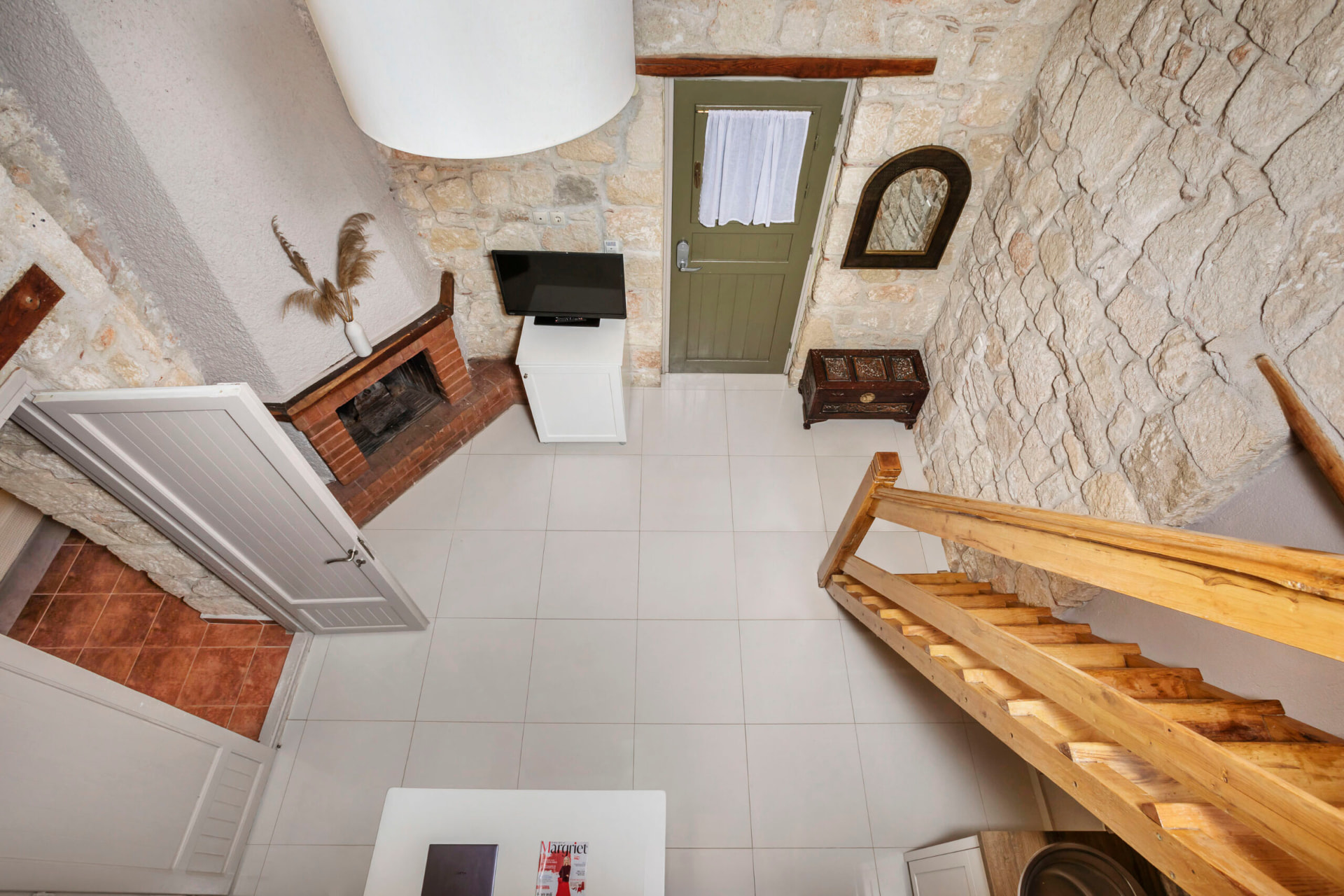 View from the loft over the living area and fireplace.
