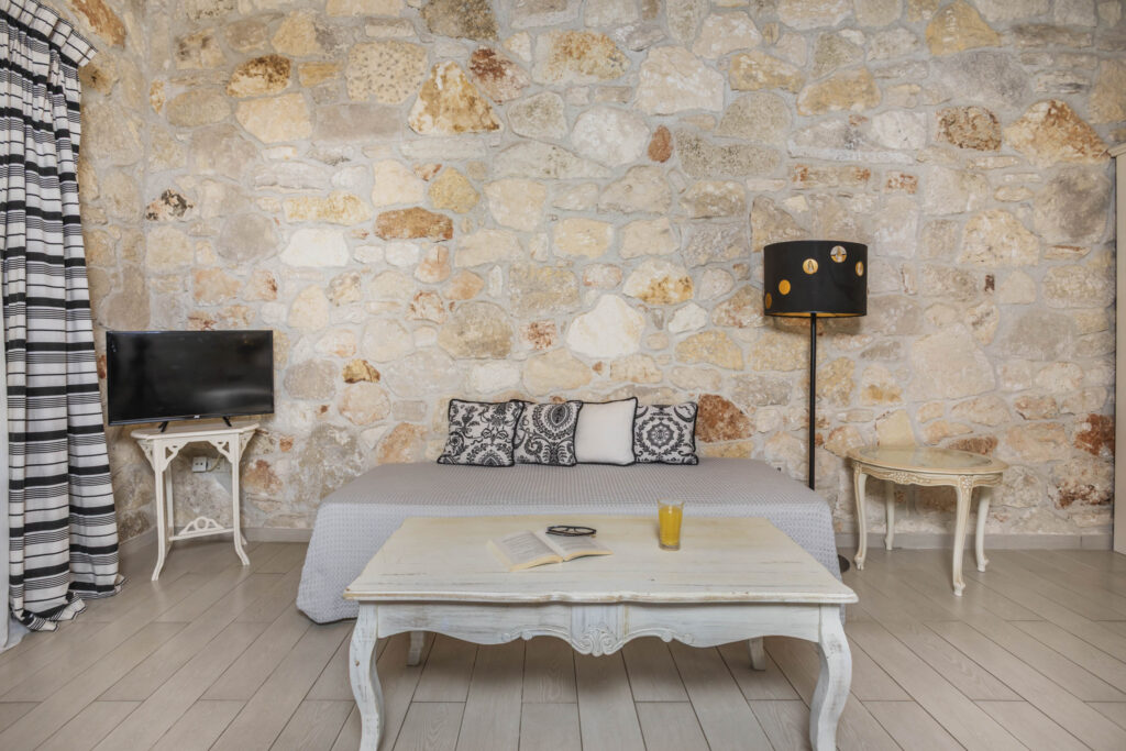 Seating corner against the natural stone wall.