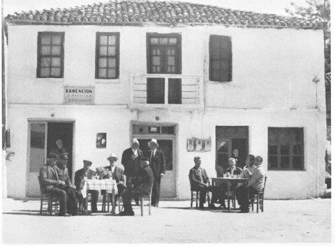 Historic kafeneio in Afytos with villagers seated outside